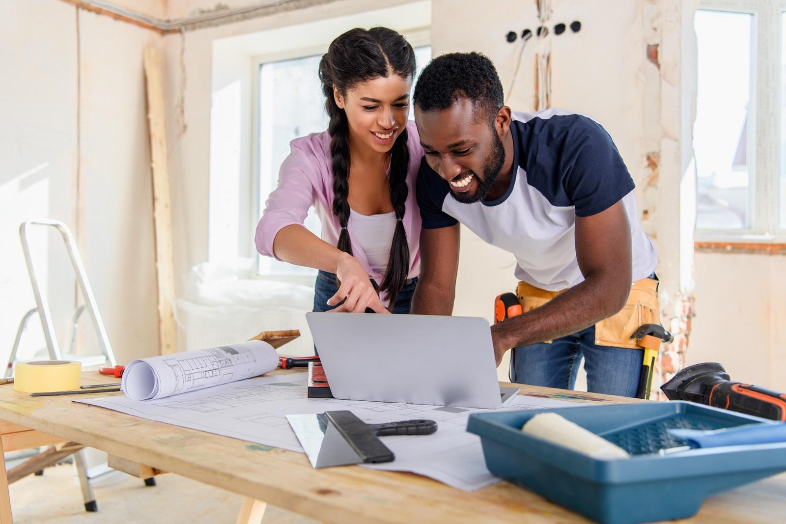 A young couple tackle a home improvement project together.